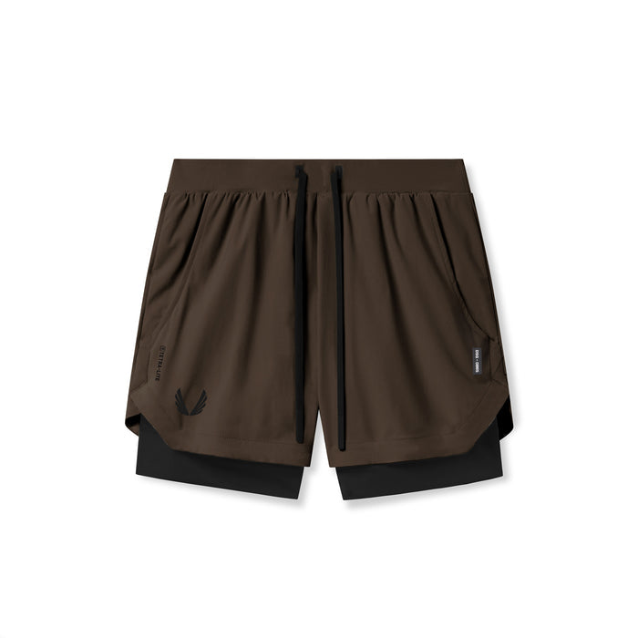 Flatlay of Tetra-Lite 5" Liner Shorts in Dark Earth and Black, front view