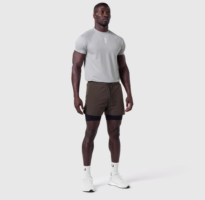 Tetra-Lite 5" Liner Short in Dark Earth and Black, worn by model standing facing forward