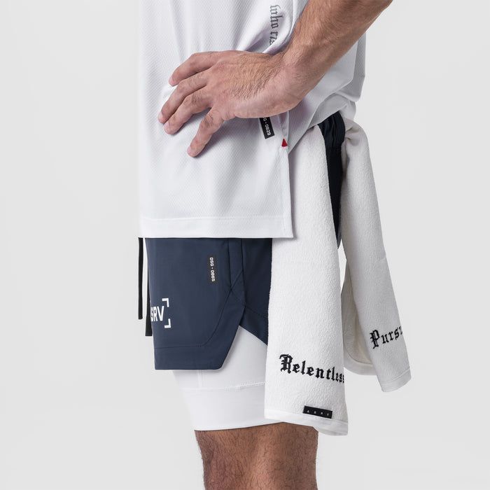 Tetra-Lite 5" Liner Short in Navy and White, worn with matching apparel, side view