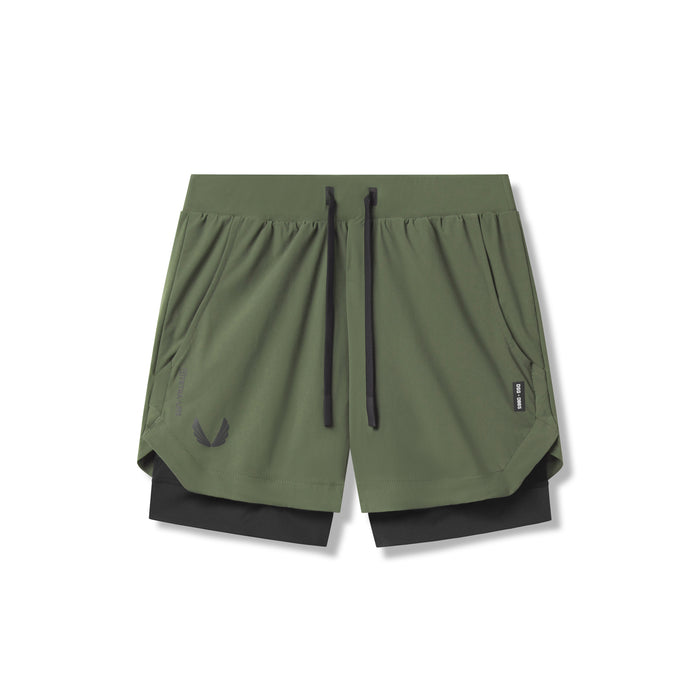 Flatlay of Tetra-Lite 5" Liner Shorts in olive and black, overhead view