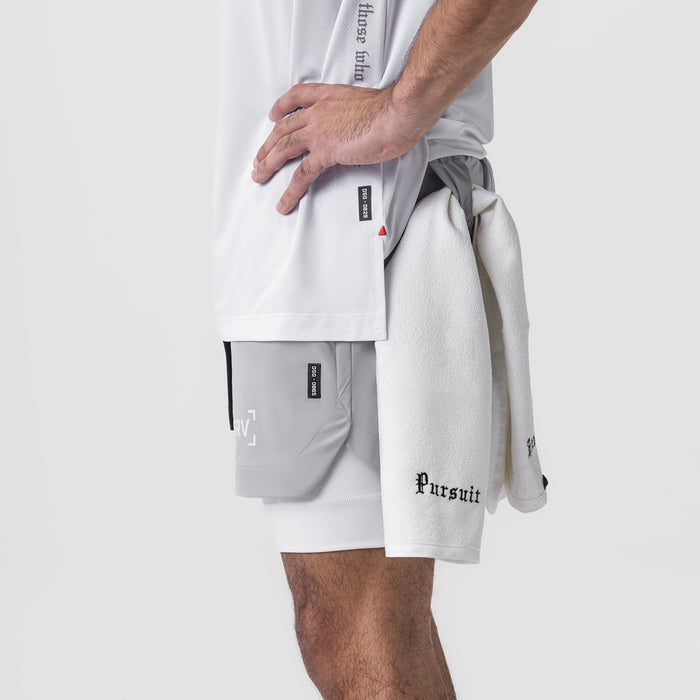 Tetra-Lite 5" Liner Short in Slate Grey, model wearing with white tee and towel, side view