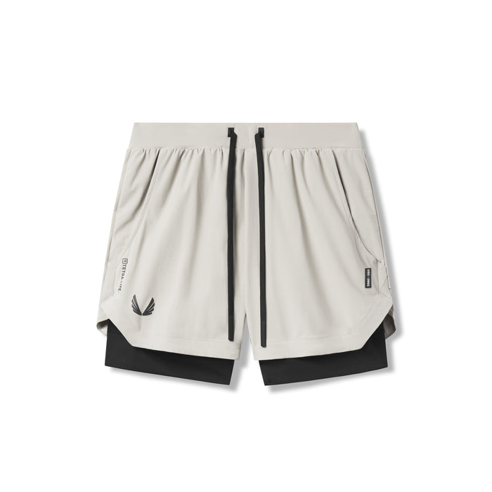 Flatlay of Tetra-Lite 5" Liner Shorts in Stone and Black, front view