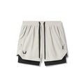 Flatlay of Tetra-Lite 5" Liner Shorts in Stone and Black, front view