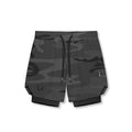 Flatlay of Tetra-Lite 7" Liner Shorts in black camo wings pattern with black liner, front view