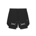 Flatlay of Tetra-Lite 7" Liner Shorts in black with white bracket logo, overhead view