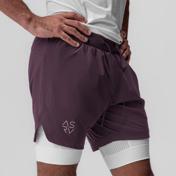 Tetra-Lite 7" Liner Short in deep purple and white, worn by model, side view