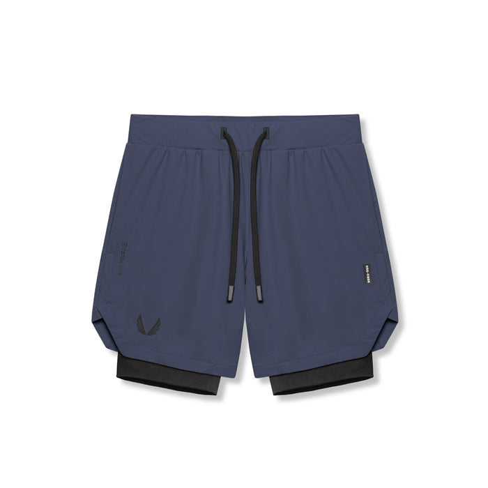 flatlay Tetra-Lite 7" Liner Short in navy and black, front view