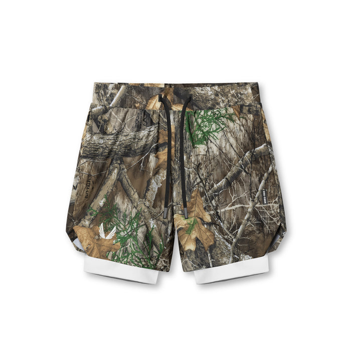 flatlay Tetra-Lite 7" Liner Short in Realtree Camo with white liner, top view