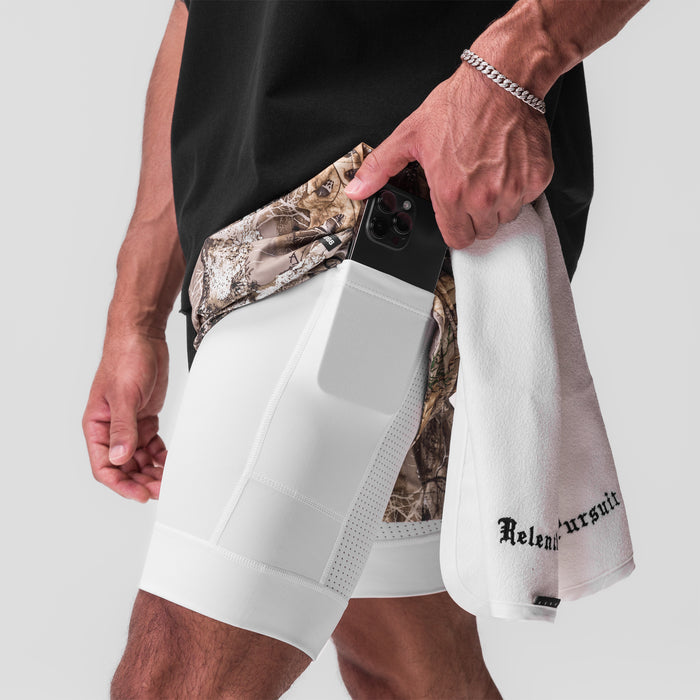 Tetra-Lite Liner Short in Realtree Camo and White, worn by model showing side pocket detail