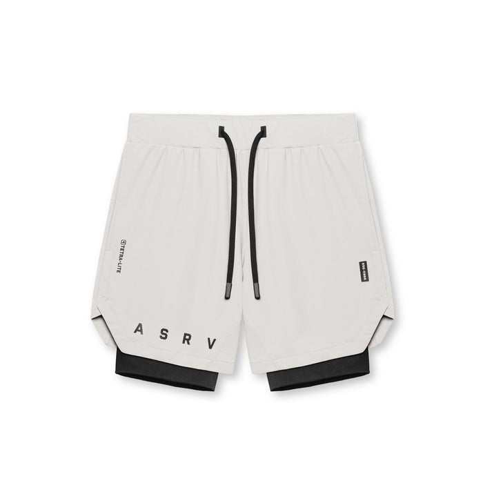 Flatlay of ASRV Tetra-Lite 7" Liner Shorts in stone and black, front view