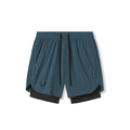 Flatlay of Tetra-Lite 7" Liner Shorts in Storm blue and black, front view