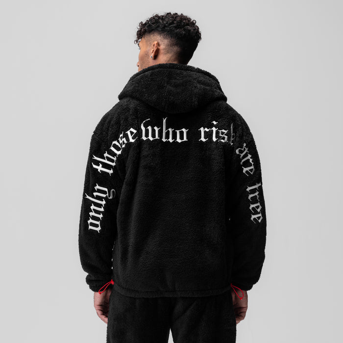 Black Sherpa Recovery Full Zip Hoodie worn by model, back view showing white text graphic