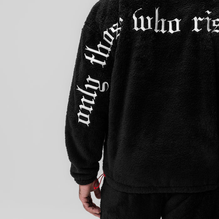 Black Sherpa Recovery Full Zip Hoodie worn by model, showing sleeve text detail and side view