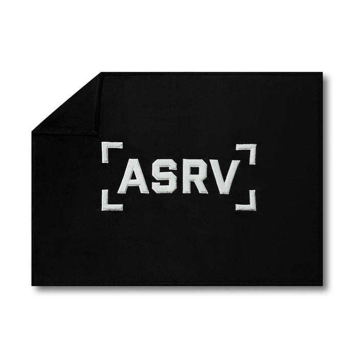 flatlay ASRV Sherpa Recovery Blanket in black with white logo, overhead view