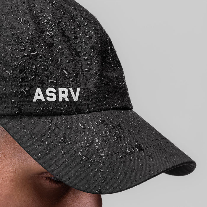 Weather-Ready Cinch Hat in black with water beads, worn by model, side view