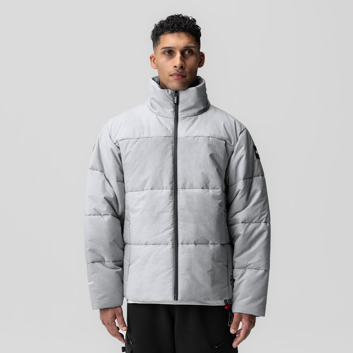 Grey Wave Dye PrimaLoft puffer jacket on model, front view