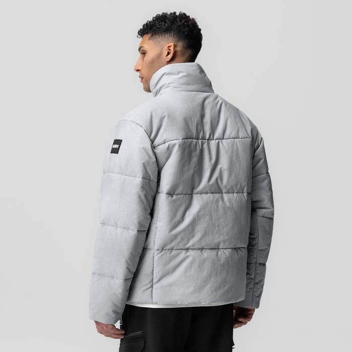 PrimaLoft Weather-Ready Puffer Jacket in grey, worn by model shown from back profile