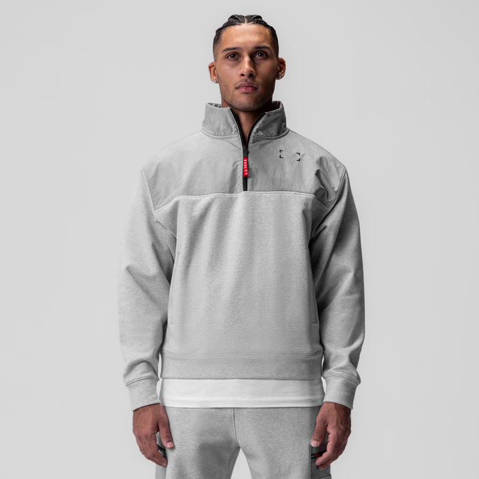 Tech-Terry Paneled Quarter Zip in Heather Grey, worn by model, front view