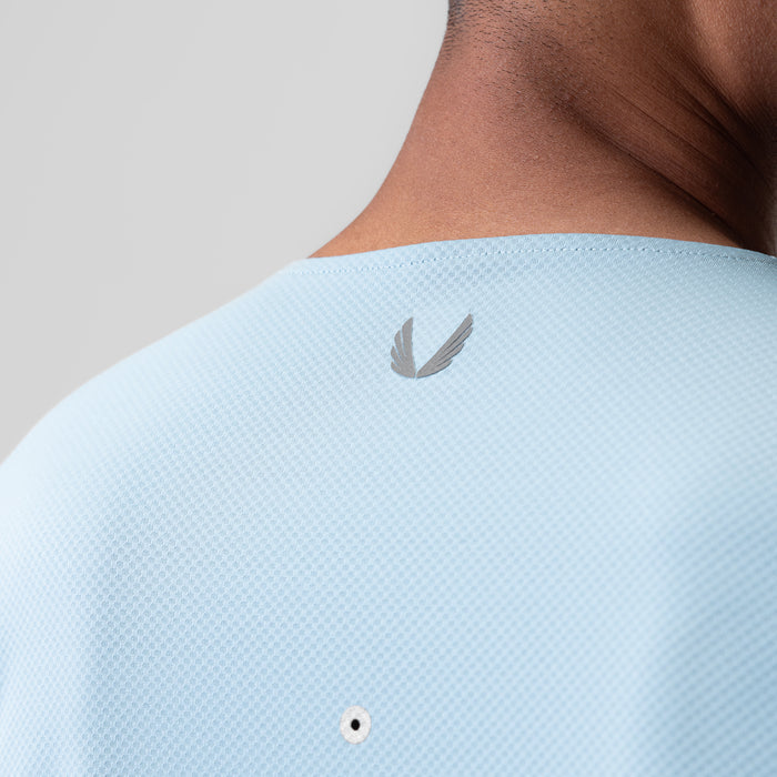 AeroSilver Training Long Sleeve in light sky worn on model, back view showing logo detail