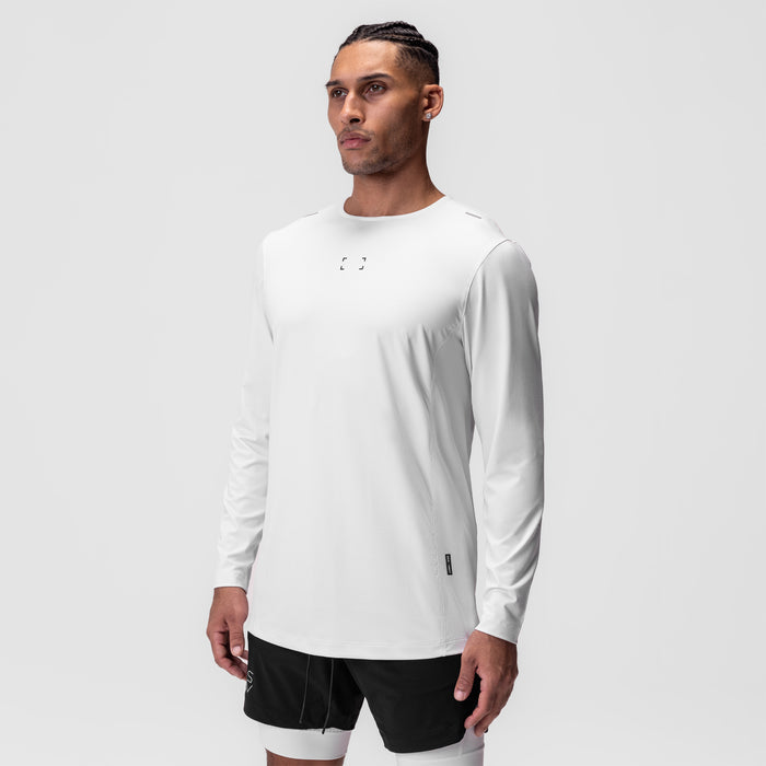 AeroSilver Training Long Sleeve in white with Space Bracket logo, worn by model with black shorts
