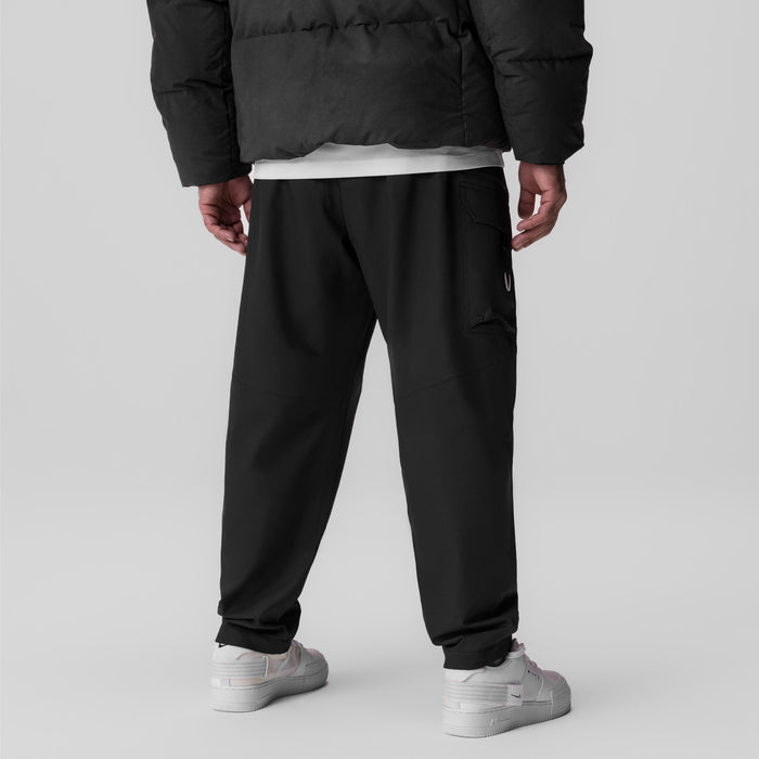 Black Tetra Weather-Ready City Pant worn by model from back view with white sneakers
