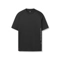 AeroSilver Fitted Tee in black with vertical text graphic, front view on model flatlay