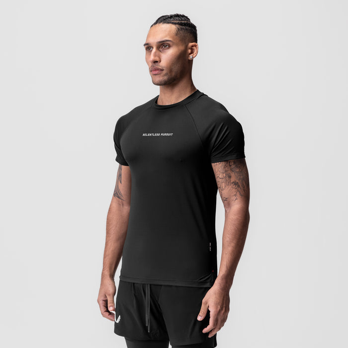 AeroSilver Fitted Tee in black with 'Relentless Pursuit' text, worn by model, front view