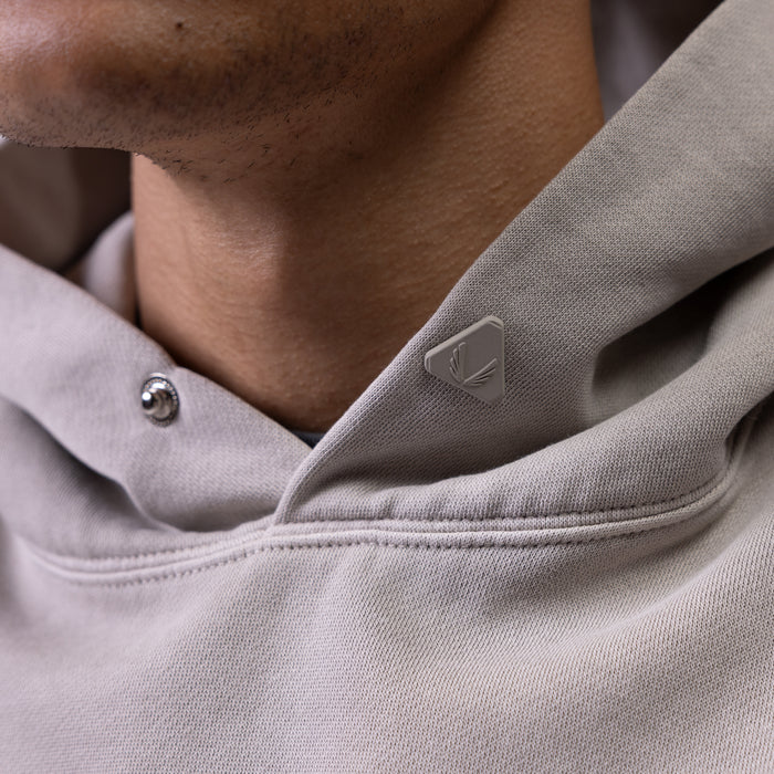 Tech Essential Distressed Hoodie in Faded Chai worn by model, close-up detail shot