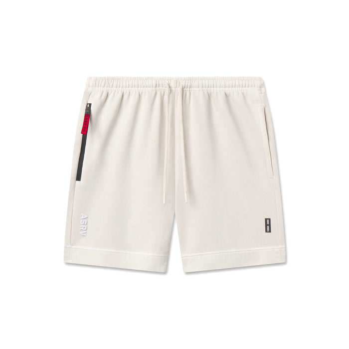 flatlay Tech Essential Sweat Short in faded stone, front view