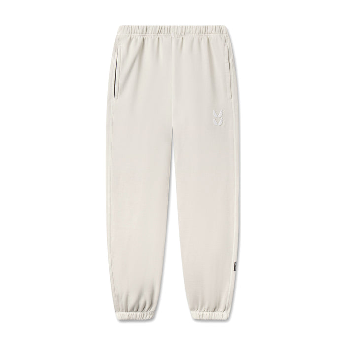 flatlay Tech Essential Sweats joggers in faded stone, front view