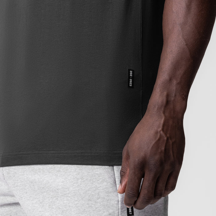 Supima Essential Tee in Space Grey worn by model, side detail view