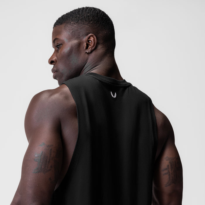 Black Supima® Muscle Tank worn by model, side profile view