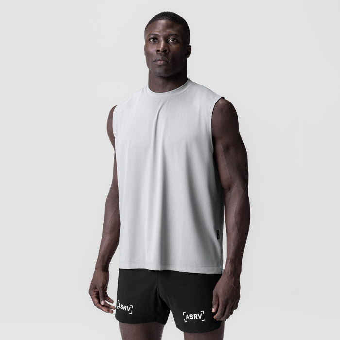 3D-Lite® 2.0 Lycra® Relaxed Cutoff shorts in black, worn with white sleeveless tank