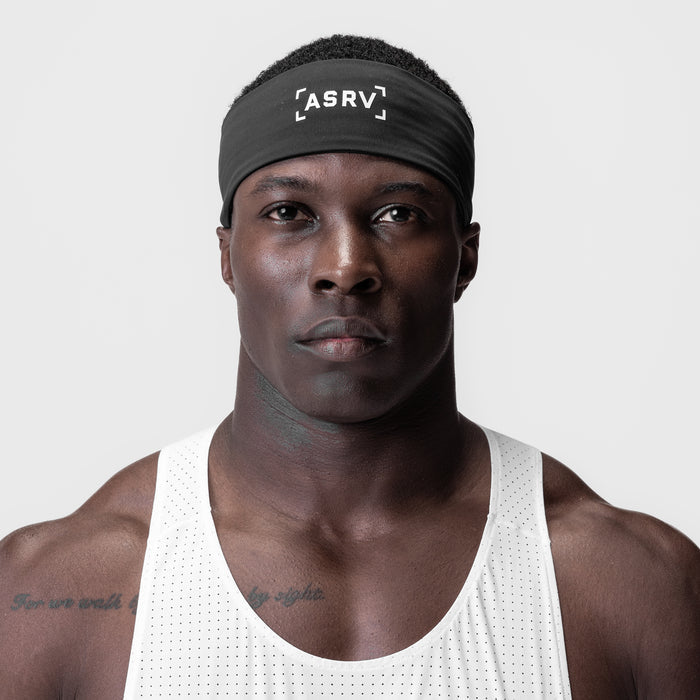 WarpFlexx Headband in black with bracket logo, worn by male model in white tank top