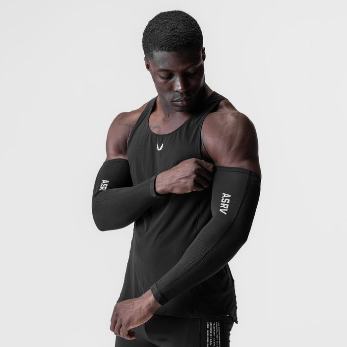 Black body-mapped arm sleeve worn on model, front view