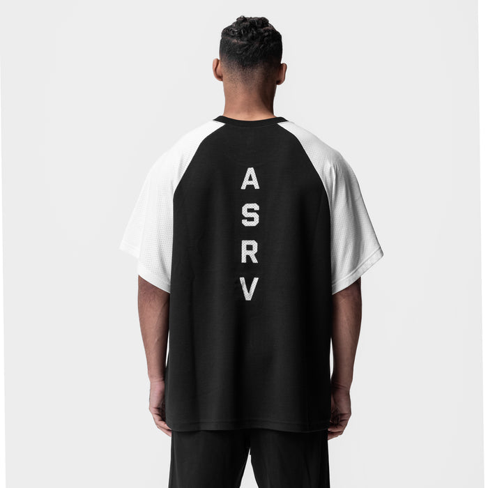Waffle knit oversized tee in black and white, back view on model