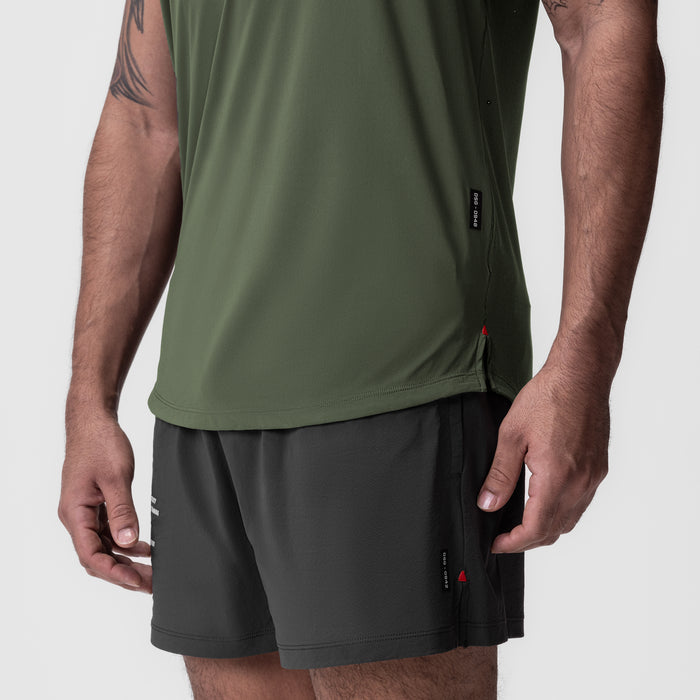 Laser-Vent Established Tee in olive worn with black shorts, side view on model