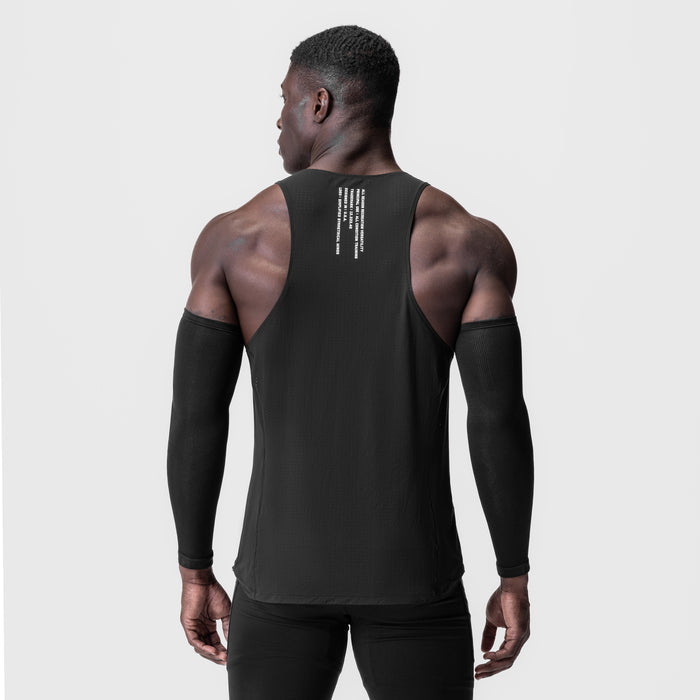 Black Laser-Vent™ Singlet Tank worn by model, back view with arm sleeves