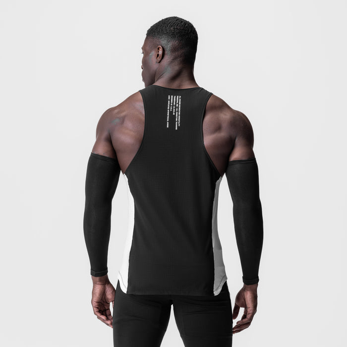 Laser-Vent™ Singlet Tank in black/white, worn by model from behind, showing back design