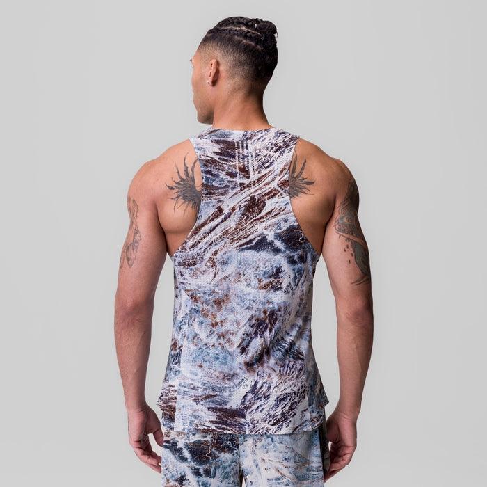 Laser-Vent™ Singlet Tank in blue marble print, worn by model showing back view