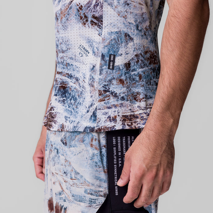 Laser-Vent Singlet Tank in blue and brown camo print, worn by model, side view