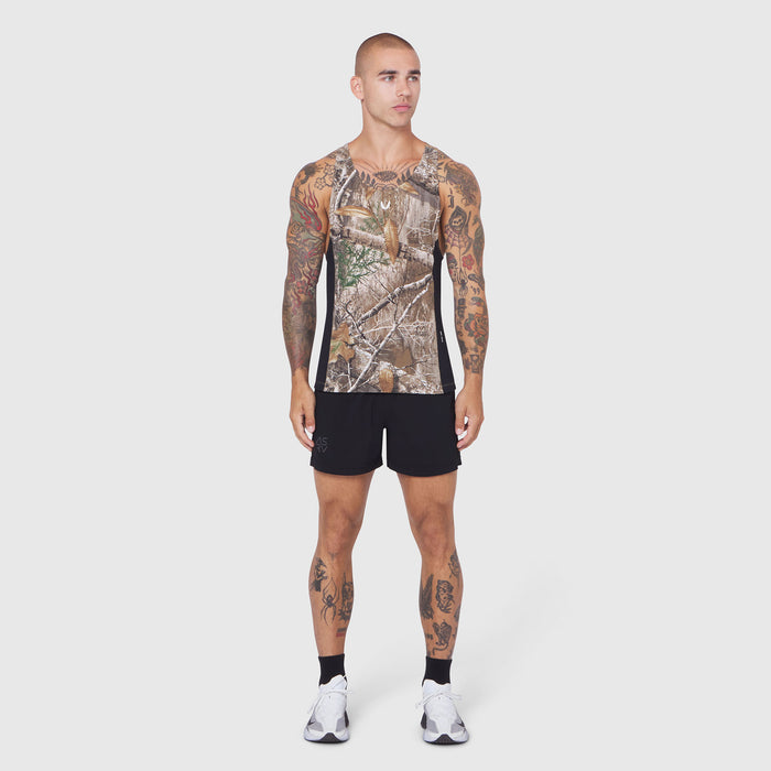 Laser-Vent Singlet Tank in Realtree Edge camo, worn by model with tattoos, front view