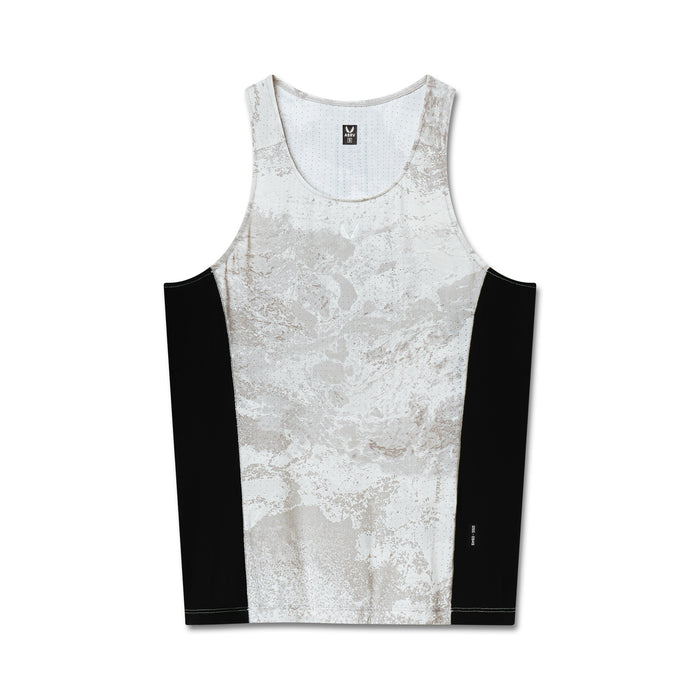 flatlay of Laser-Vent Singlet Tank in white marble with black side panels, front view