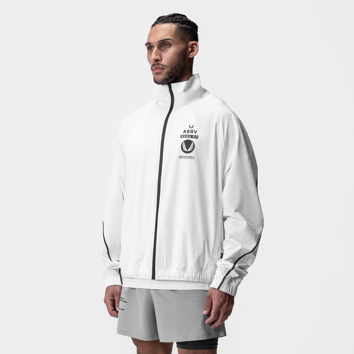 Aerotex™ Track Jacket in white with black zip, modeled on male figure, side view