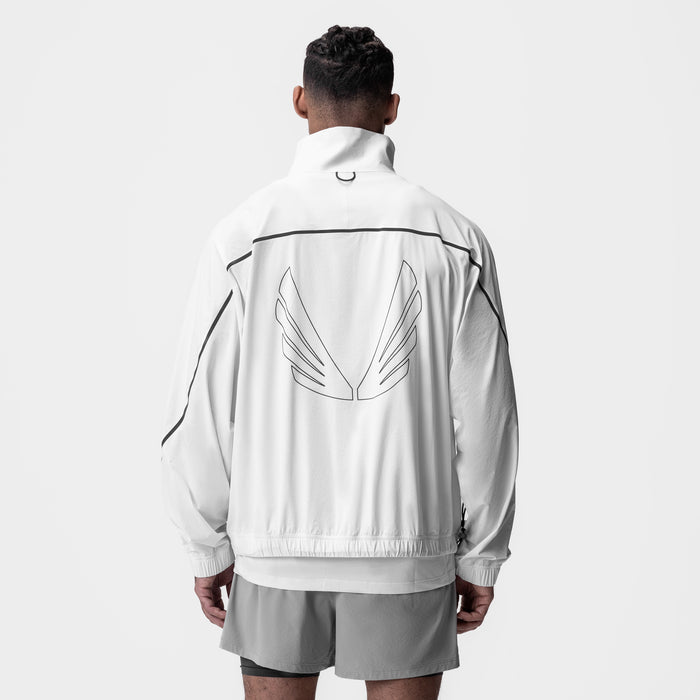 Aerotex™ Track Jacket in white with black trim, worn by model from back view showing wing graphic