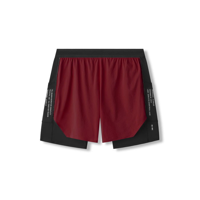 flatlay Aerotex Hybrid Liner Short in crimson and black, front view