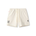 flatlay of cream waffle knit sweat shorts with drawstring waist and logo detail, front view