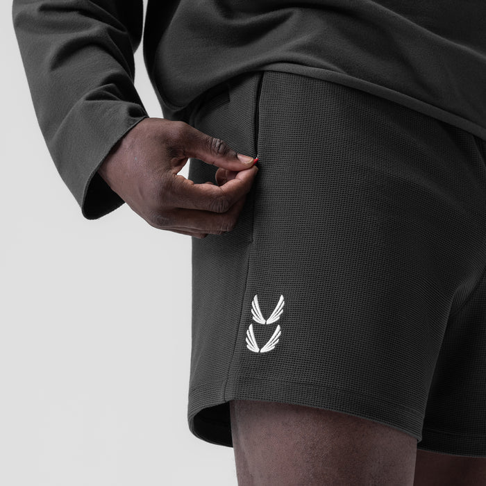 Waffle knit sweat shorts in space grey worn by model, side detail view