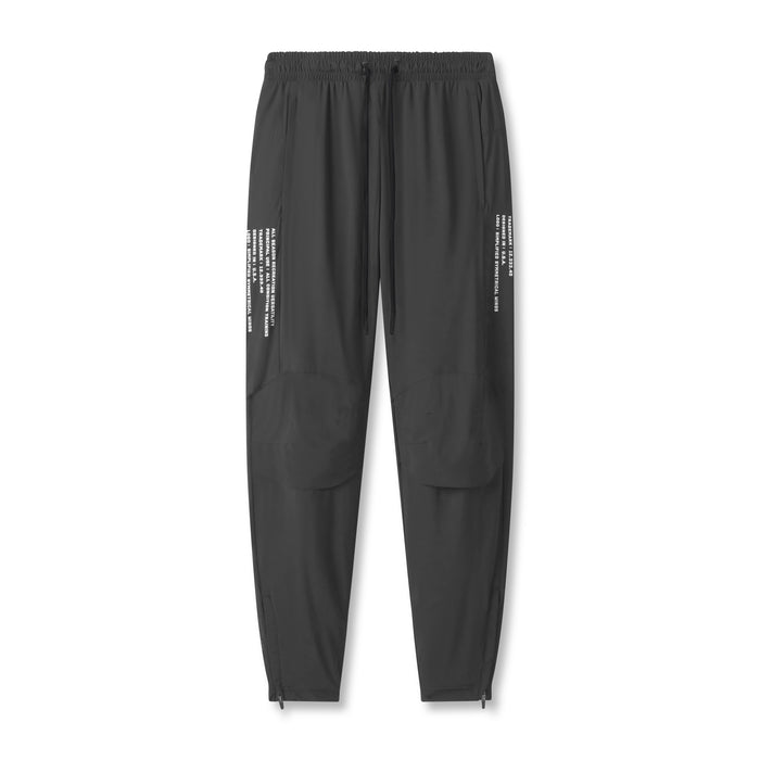 flatlay Tetra-Lite® Moto Jogger in space grey with multi-text detailing, front view