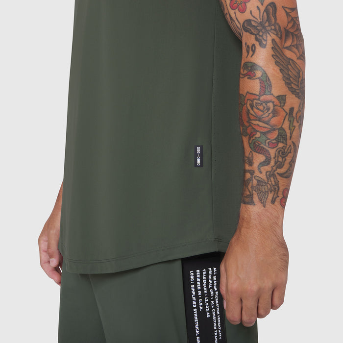 Laser-Vent Tank Top in olive worn by model, side view showing fit and tattoo sleeve